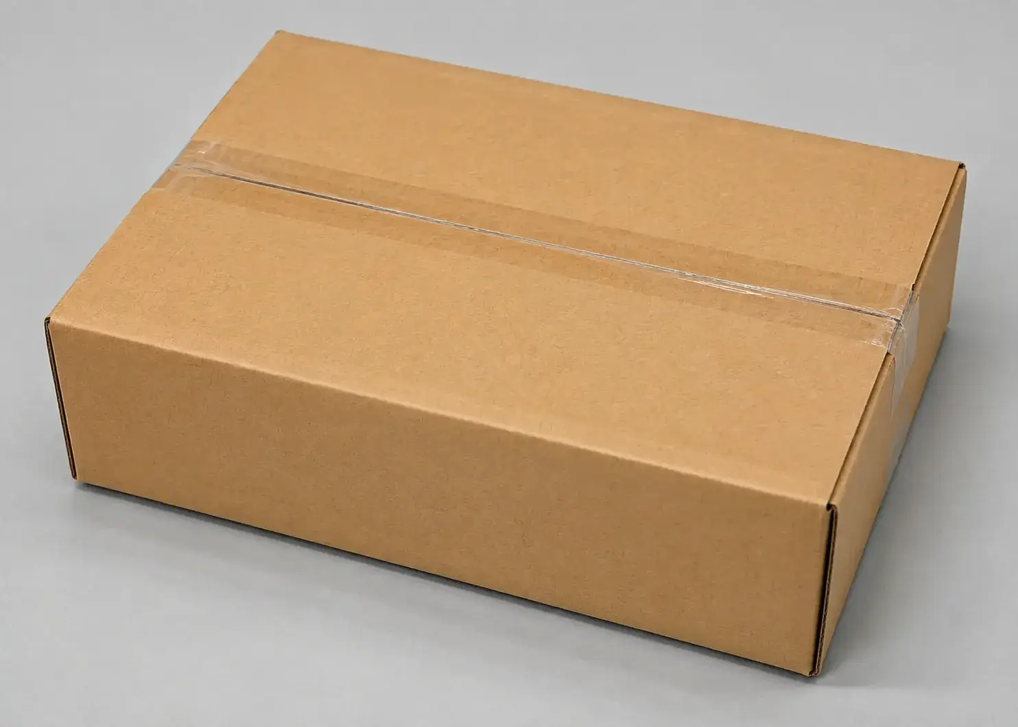 Sealed kraft cardboard shipping box prepared for product delivery