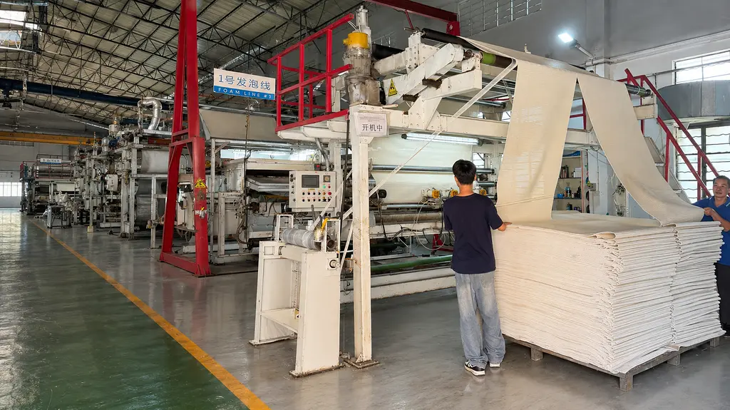 uwin-foam-mat-production-line-v2 UWIN Foam Line No. 1 producing textured mats in a multi-machine factory workshop